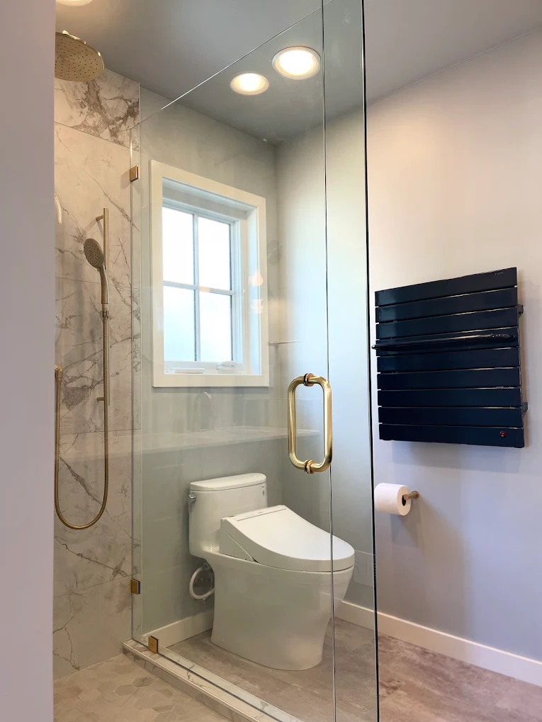 Marble and brass bathroom remodel by Chinchilla Construction